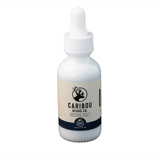 a 1oz/30ml white dropper bottle of Caribou Beard Co's Beard Oil in Alpine Breeze scent, front on view.